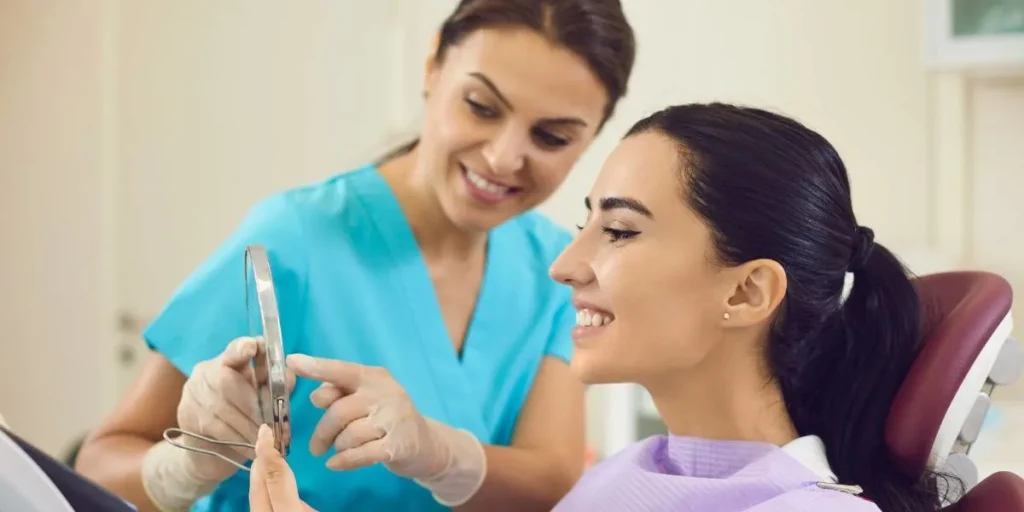 Dentist examining patient for restorative dental implants procedure