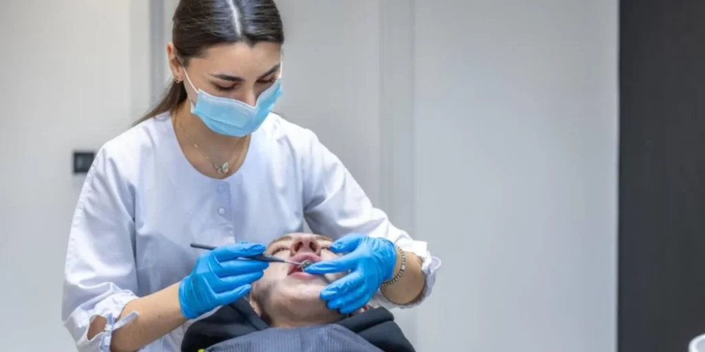 Dentist performing same day tooth extraction in Atlanta