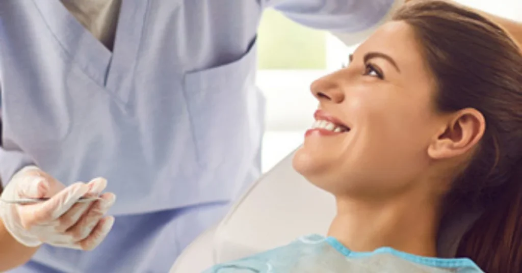 Dentist performing oral surgery procedure